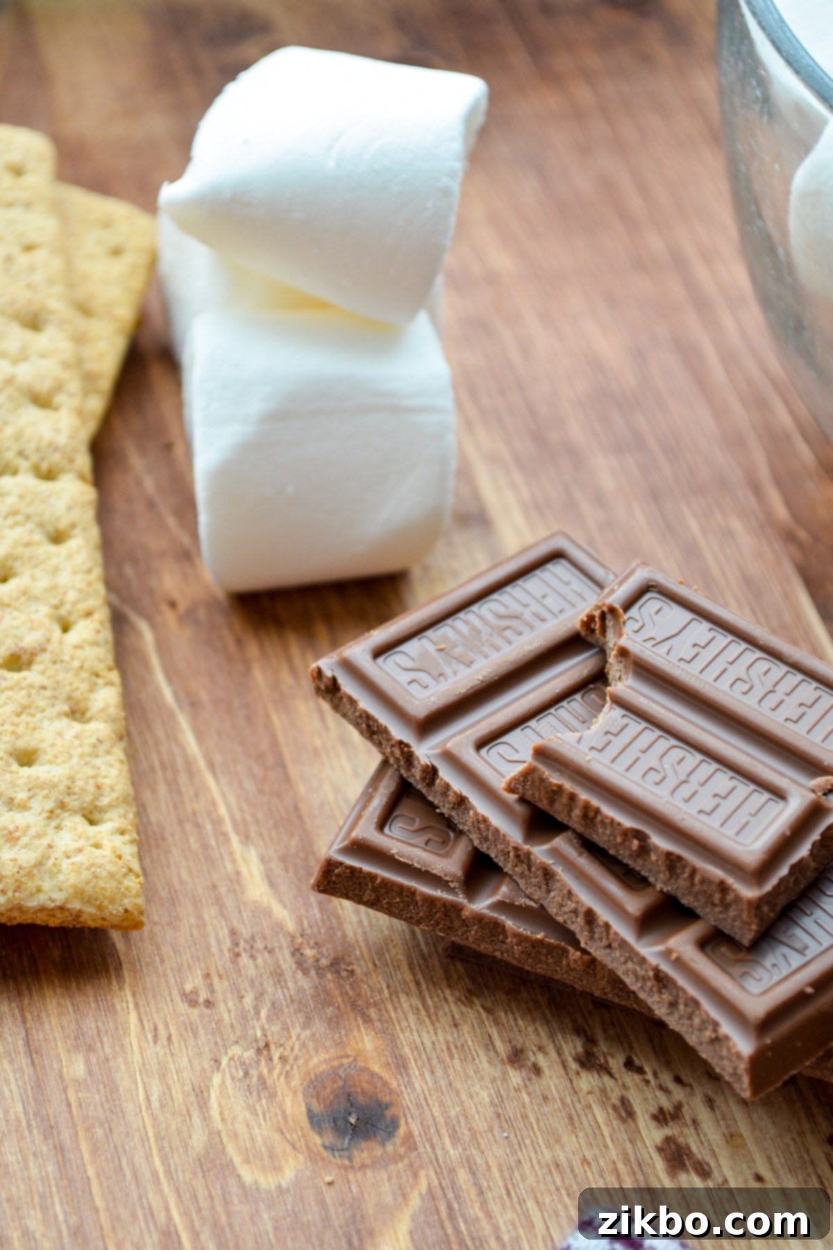 A few bars of chocolate, some marshmallows, and some graham crackers.