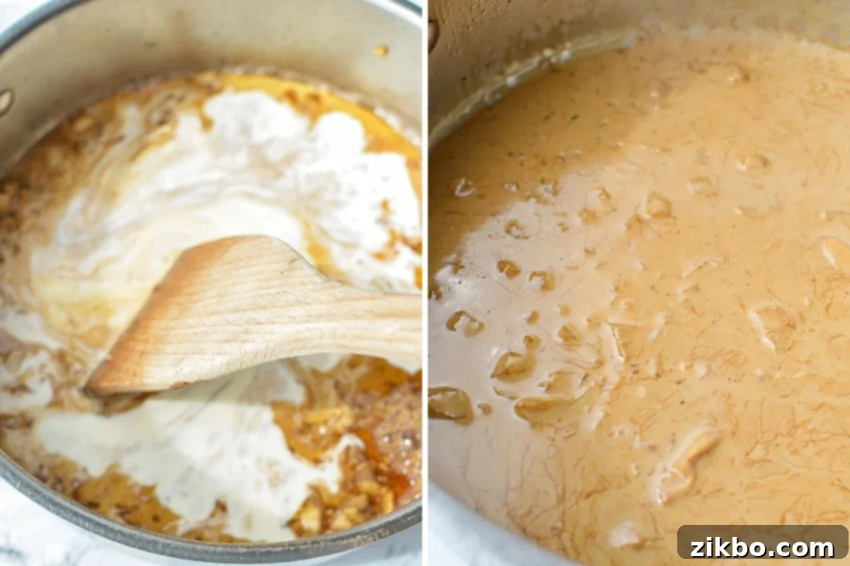 Scraping up the bottom of the skillet to incorporate everything into a creamy sauce. A wooden spoon is actively scraping the bottom of a skillet, mixing the browned bits into a simmering white creamy sauce.