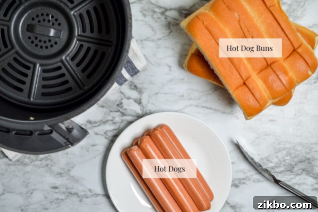 The ingredients needed to make air fryer hot dogs: hot dogs and hot dog buns.