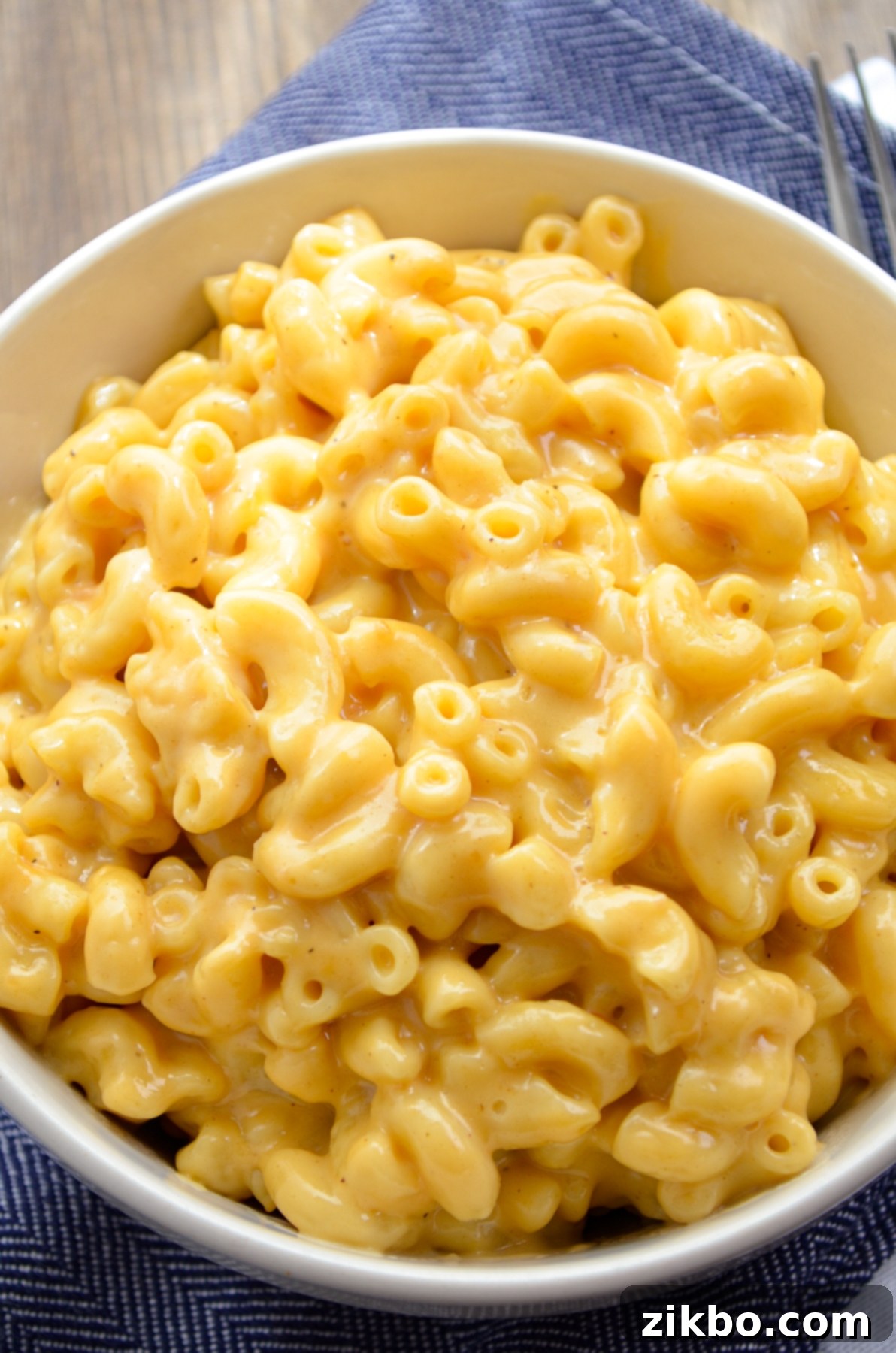 Quick and Creamy 5-Ingredient Instant Pot Velveeta Mac and Cheese 4 A large bowl of macaroni and cheese, freshly made in the Instant Pot, with a spoon ready to serve.