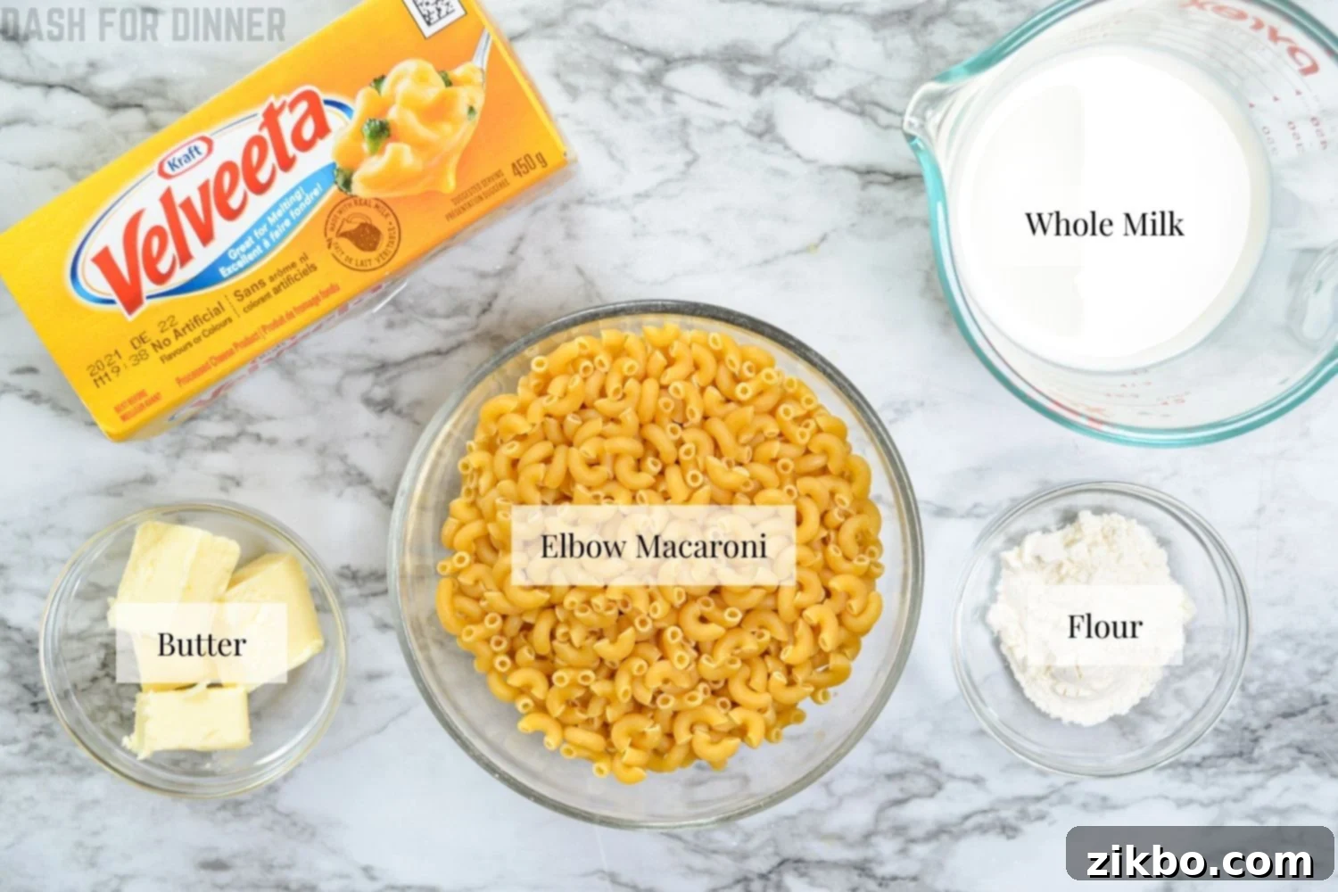 Quick and Creamy 5-Ingredient Instant Pot Velveeta Mac and Cheese 5 The five core ingredients needed to make 5-ingredient instant pot mac and cheese laid out on a table.