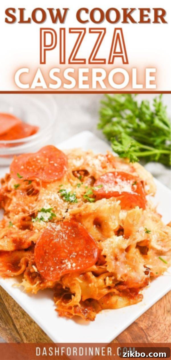 Slow Cooker Pizza Delight 9 A large serving bowl filled with a hearty portion of pizza casserole, beautifully garnished with fresh parsley sprigs.