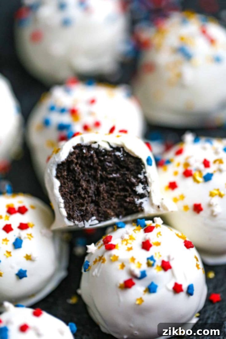4th of July Oreo Truffles, covered in white chocolate and festive patriotic sprinkles, a delightful no-bake treat.