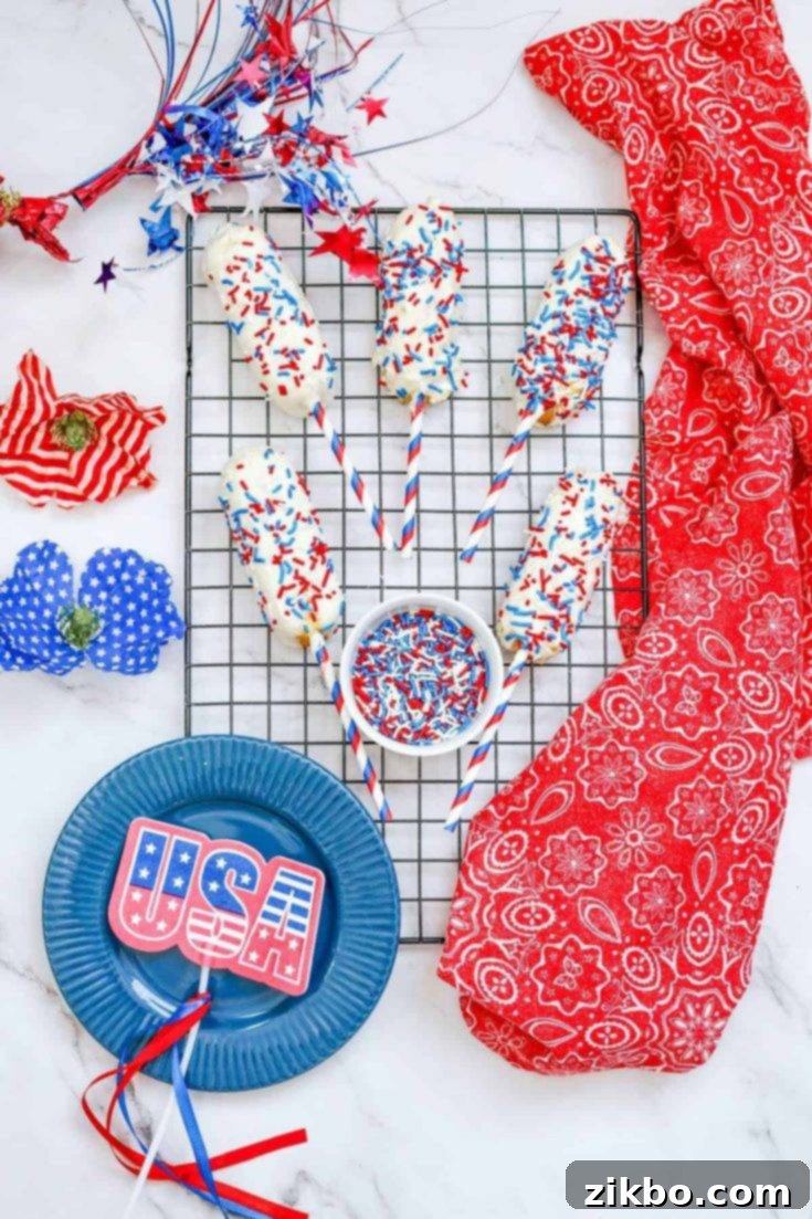 Patriotic Chocolate Covered Twinkies, adorned with red, white, and blue sprinkles, a super easy and festive treat for holidays.