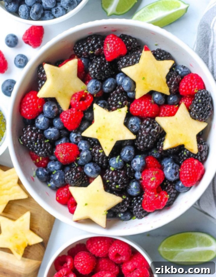 Refreshing Berry Fruit Salad with red and blue berries, adorned with festive melon stars, perfect for a patriotic summer dessert.