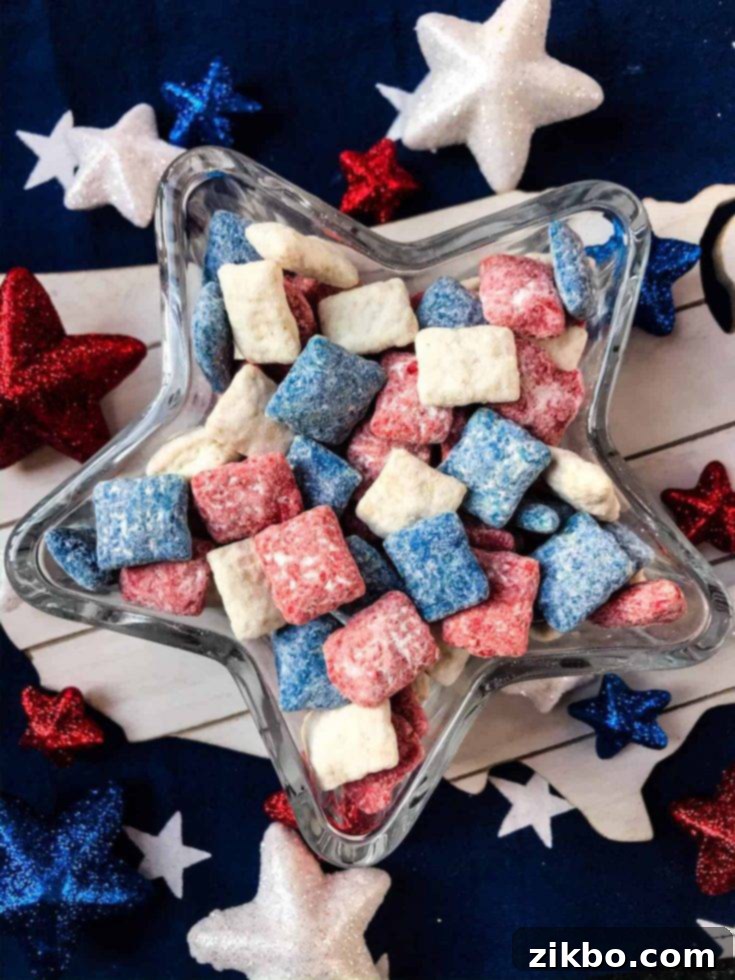Patriotic Red, White, and Blue Puppy Chow, a crunchy snack mix perfect for 4th of July parties and cookouts.