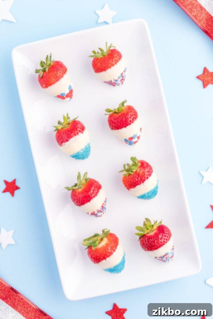 Red, White, and Blue Strawberries, chocolate-dipped and covered in patriotic sprinkles, a fun and easy dessert.