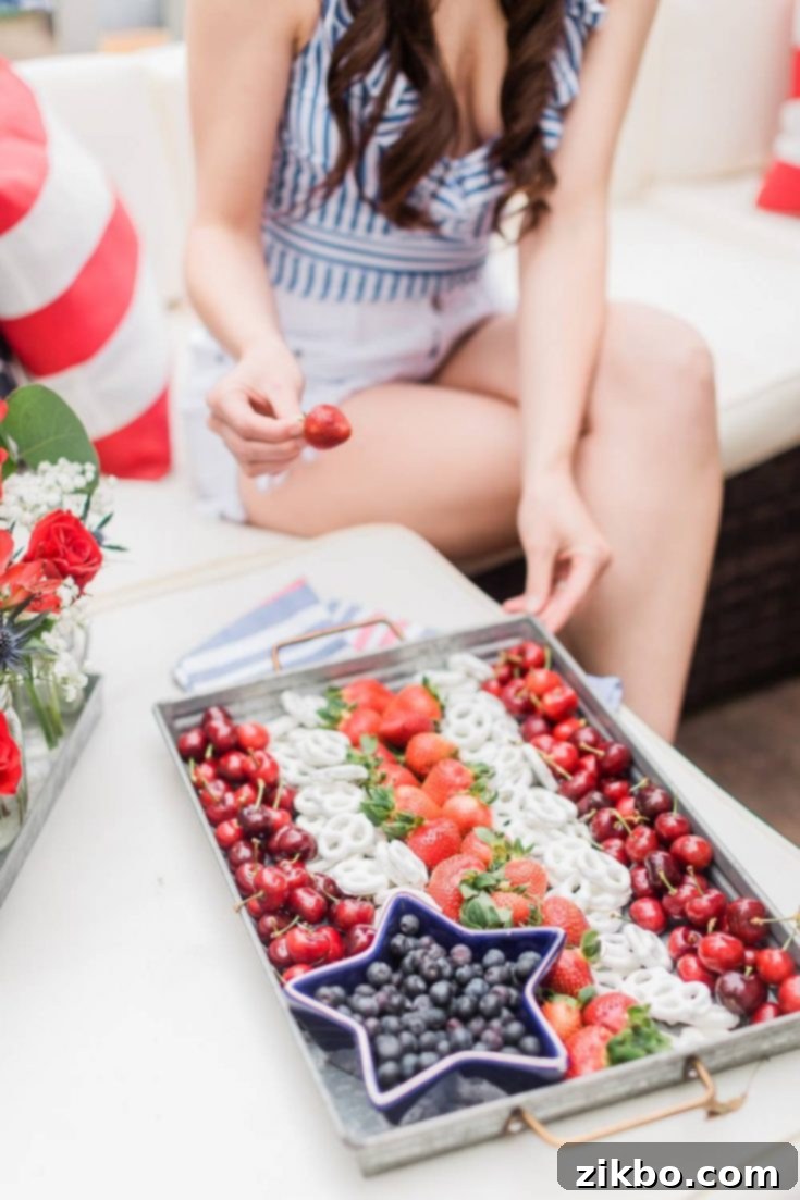 An American Flag Snack Tray, arranged with healthy red, white, and blue fruits, perfect for a 4th of July gathering.