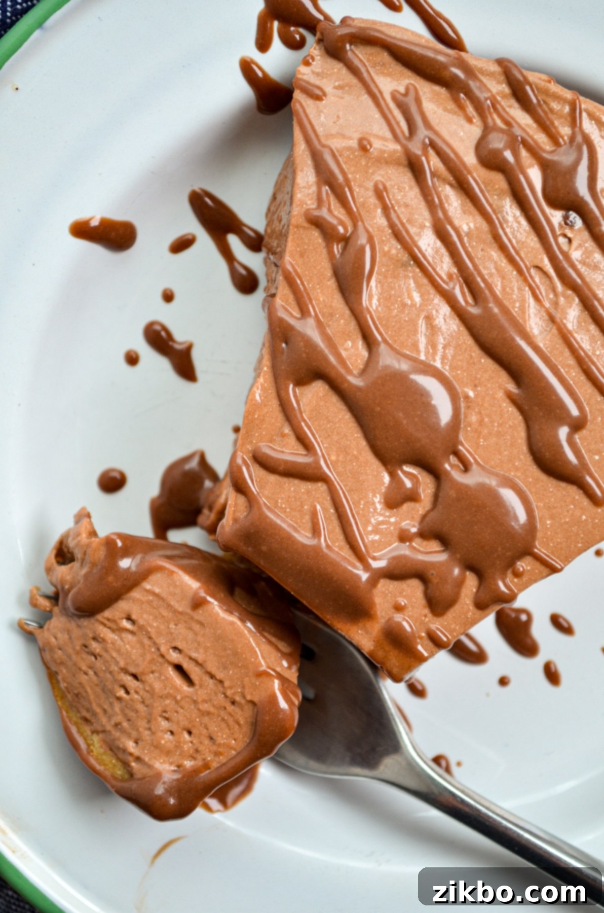 A slice of nutella pie, drizzled with nutella ganache.