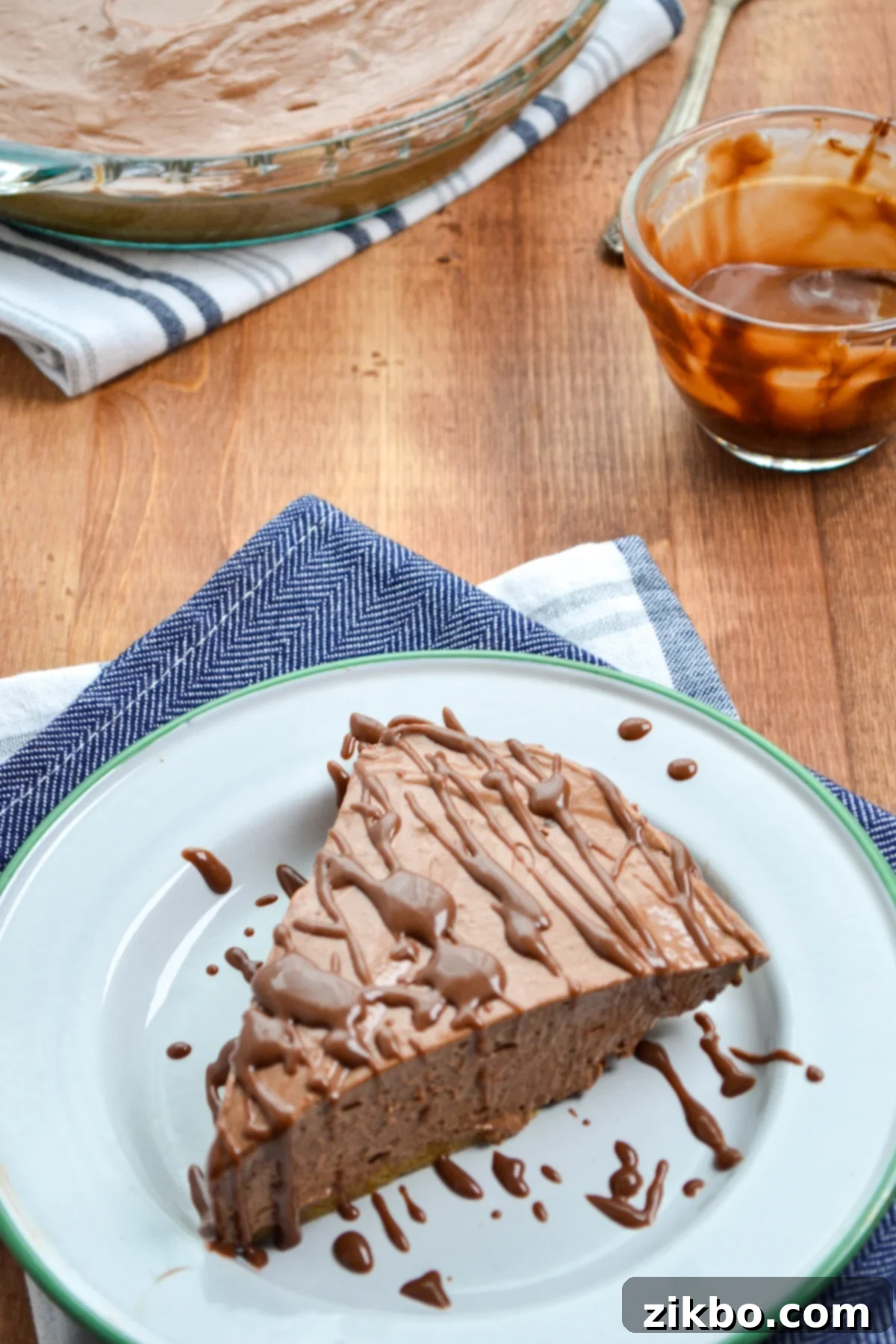 A slice of nutella pie, drizzled with nutella ganache.
