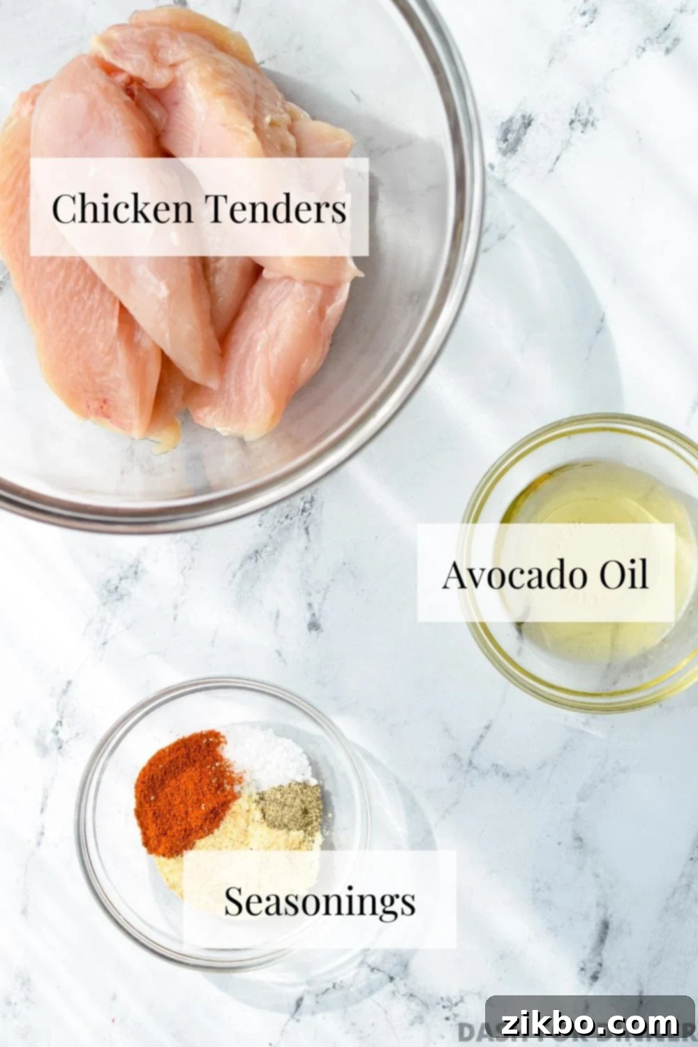 The ingredients needed to make air fryer chicken tenders: tenderloins, oil, and seasoning.