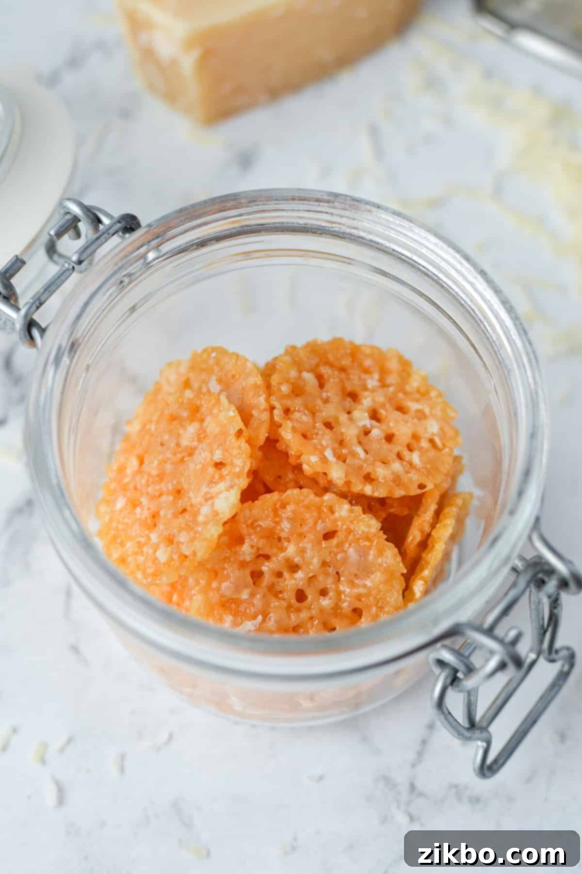 Savory Parmesan Snaps 7 A jar with parmesan crisps inside.