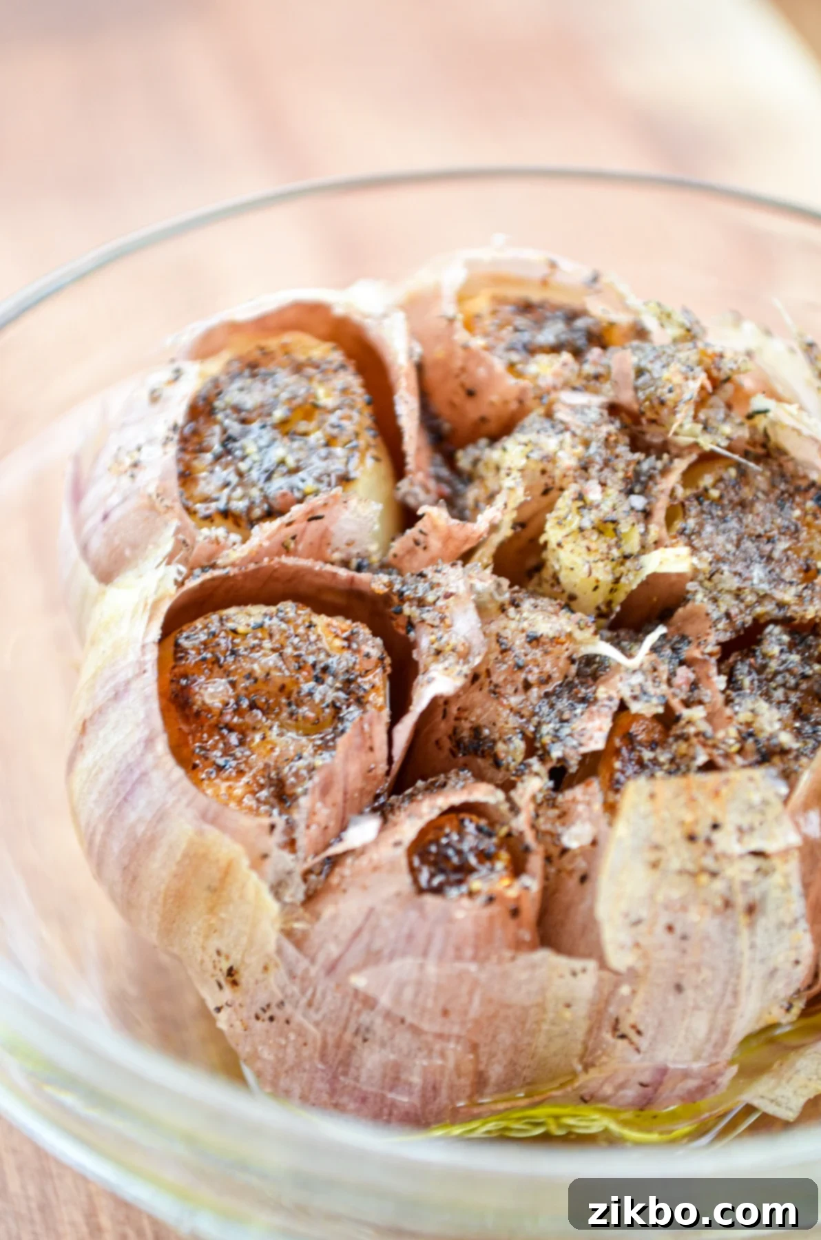 A beautifully roasted garlic bulb, perfectly caramelized and ready to be enjoyed, prepared in an air fryer.