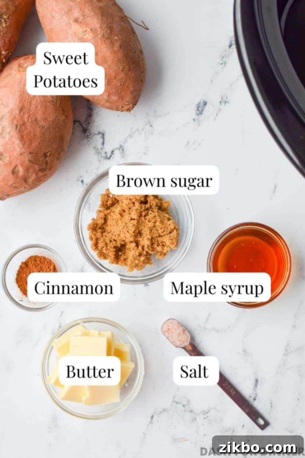 The ingredients needed to make slow cooker glazed sweet potatoes: sweet potatoes, brown sugar, maple syrup, cinnamon, butter, and salt.