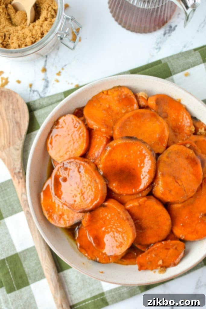 A shallow bowl filled with cooked sweet potato slices.
