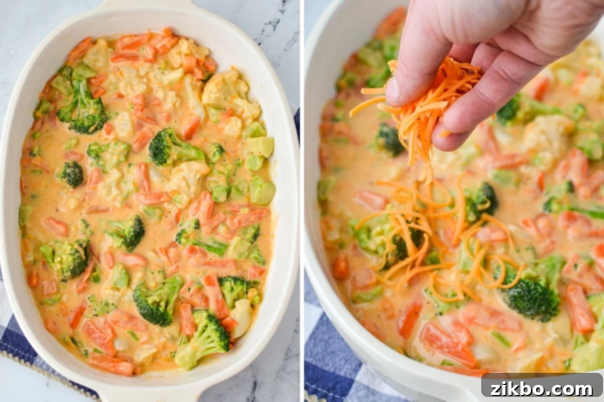 Sprinkling the remaining shredded cheddar cheese over the top of the assembled vegetable casserole in a baking dish.
