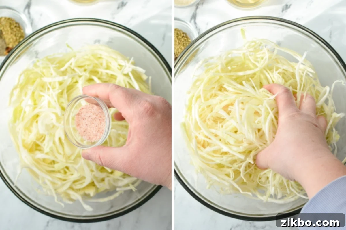 Adding salt to a bowl of shredded cabbage.