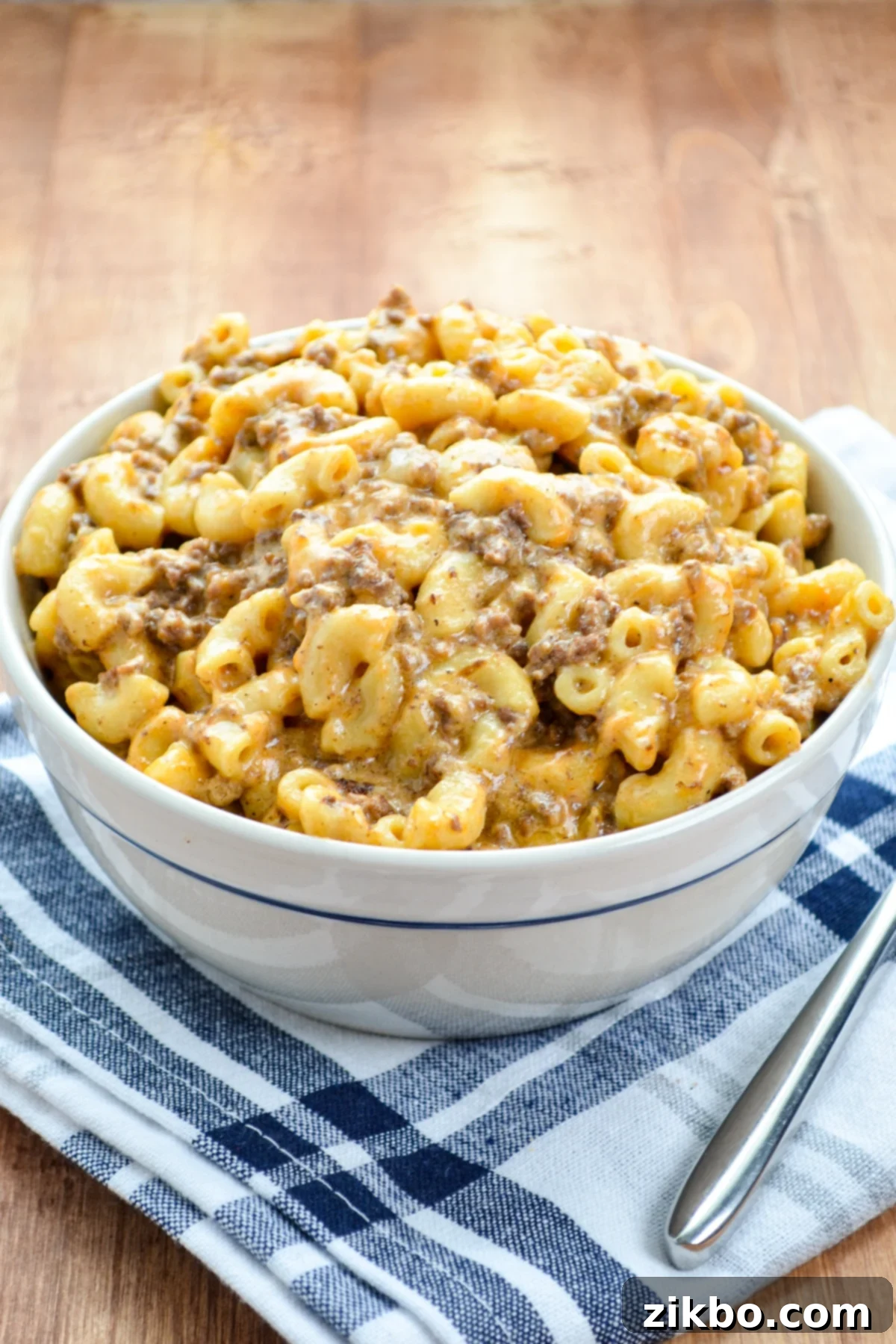 A bowl of homemade Hamburger Helper that was prepared in the Instant Pot, garnished with fresh parsley.