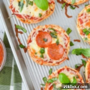 Easy English Muffin Pizzas 11 English muffin pizzas on a sheet pan.