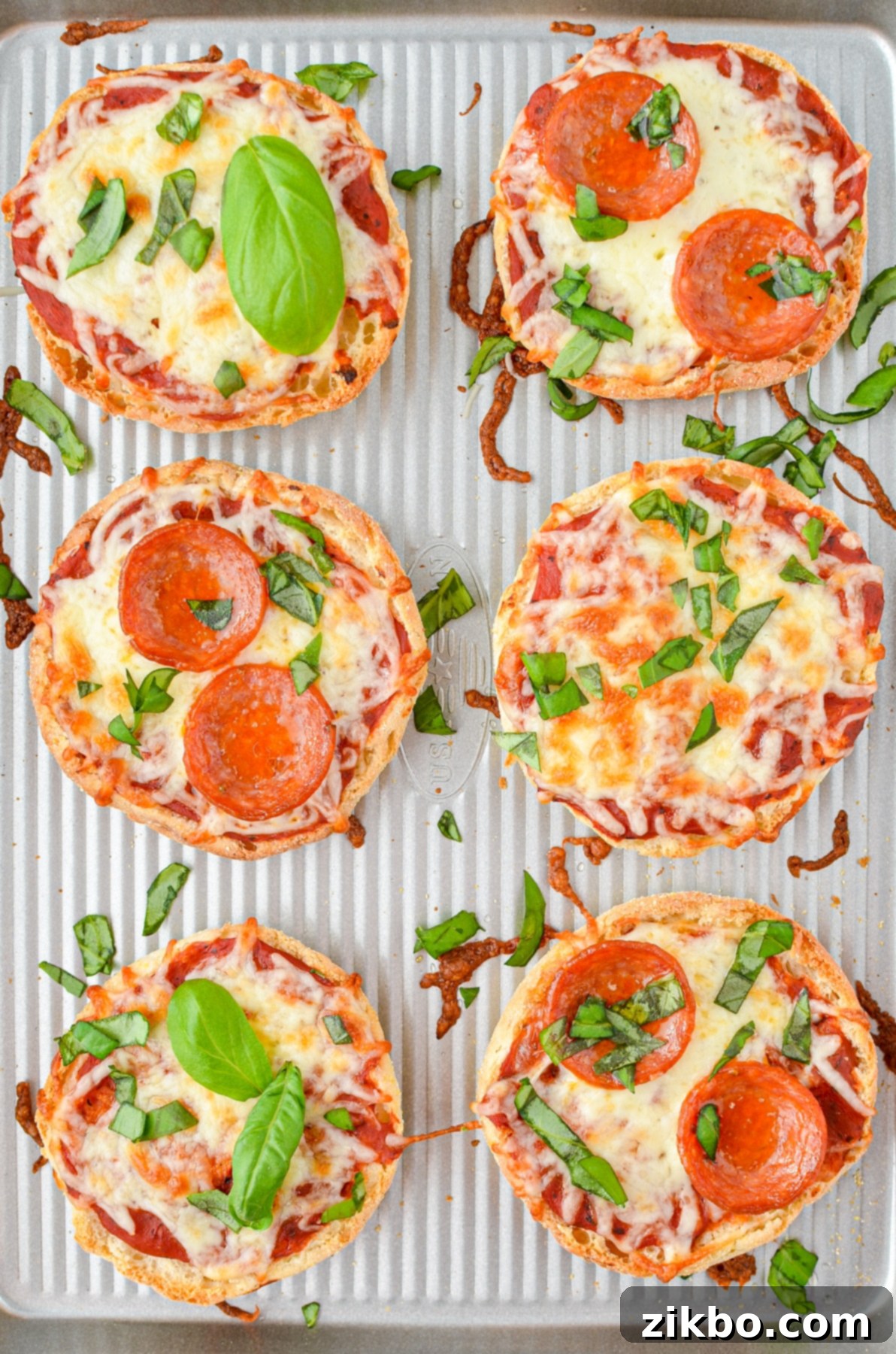 Easy English Muffin Pizzas 9 A baking sheet with mini pizzas.