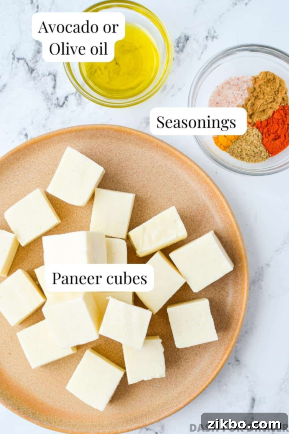 Quick Air Fryer Paneer 3 The ingredients needed to make air fryer paneer: paneer, seasonings, and oil.