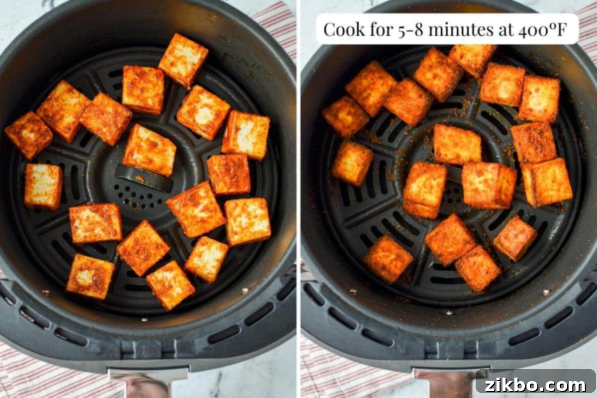 Quick Air Fryer Paneer 5 An air fryer basket with seasoned, and then cooked paneer cubes.