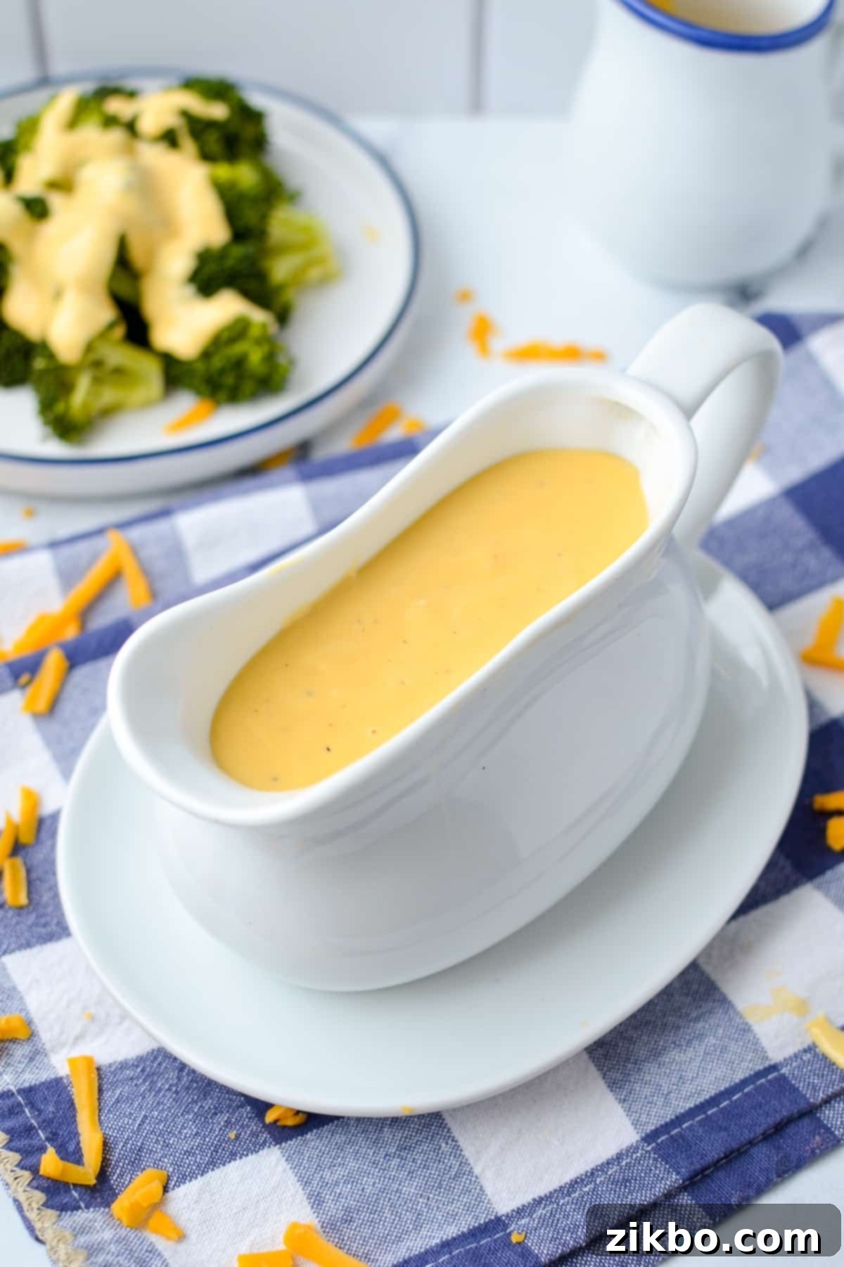 Cheese sauce in a gravy boat.
