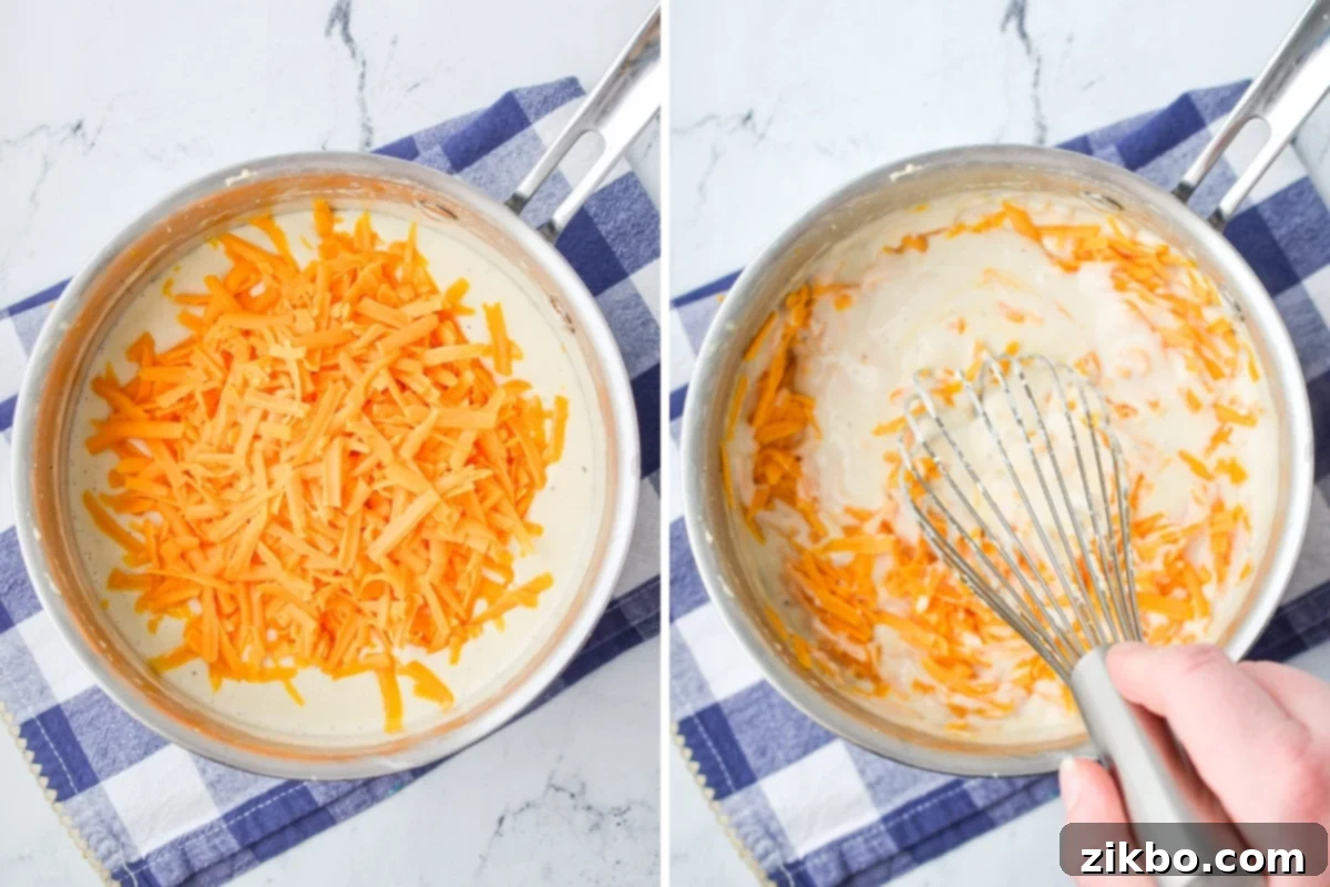 Whisking cheese into a hot white sauce.