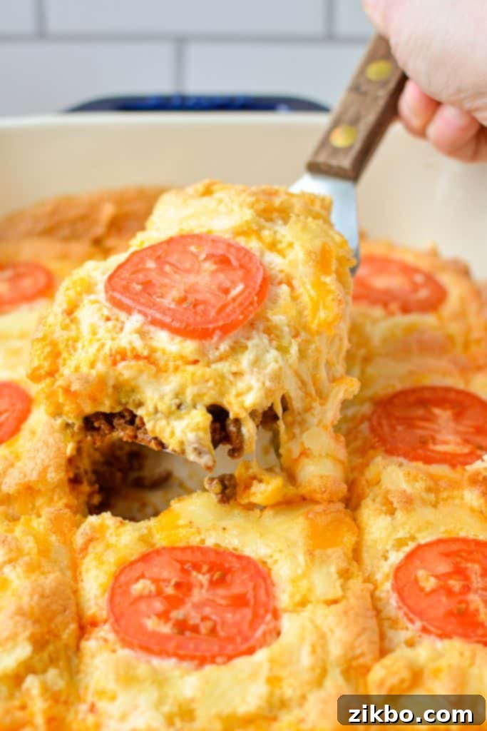 Removing a slice of casserole from a baking dish.