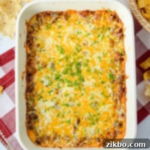 Easy Chili Cheese Dip 10 A baking dish filled with a cheesy dip, bubbling and golden.