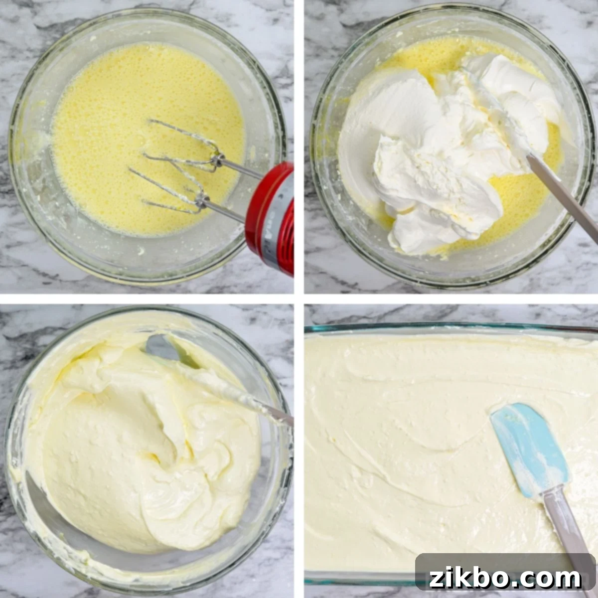 The cream cheese and lemon gelatin mixture being blended for a smooth, cheesecake-like Jell-O layer.