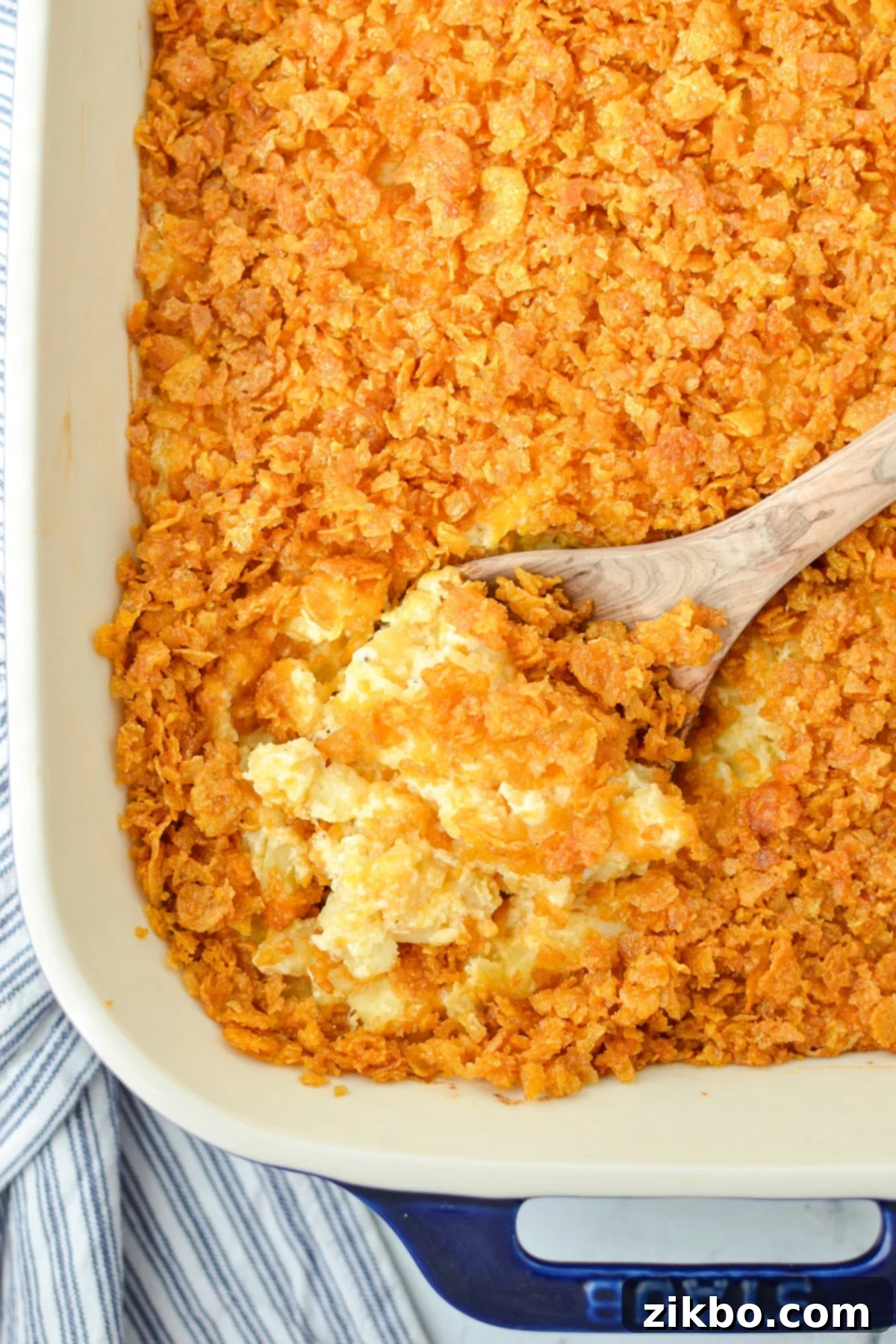 A baking dish with hash brown casserole in it.