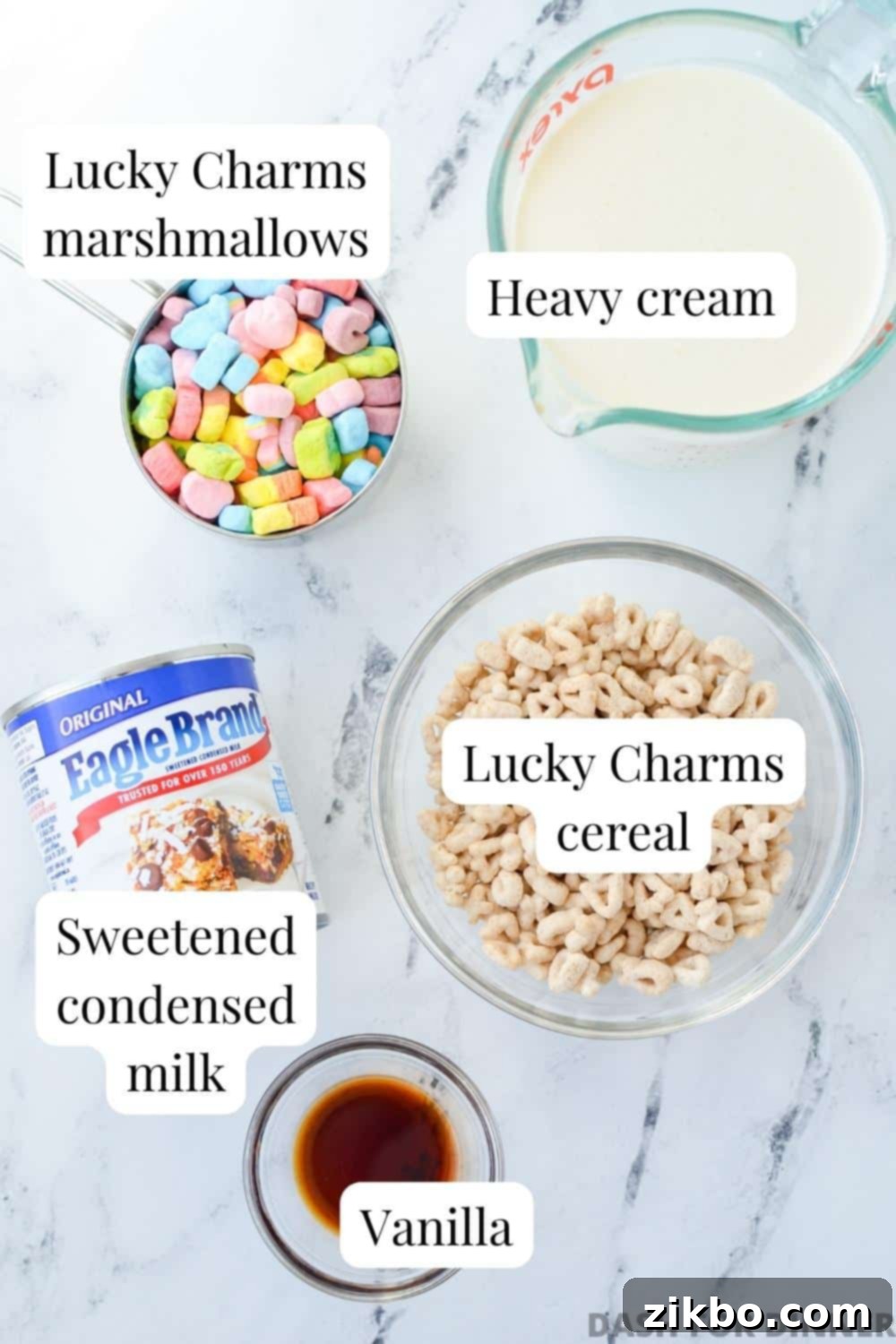 The four key ingredients for Lucky Charms ice cream: Lucky Charms cereal, heavy cream, sweetened condensed milk, and vanilla extract.