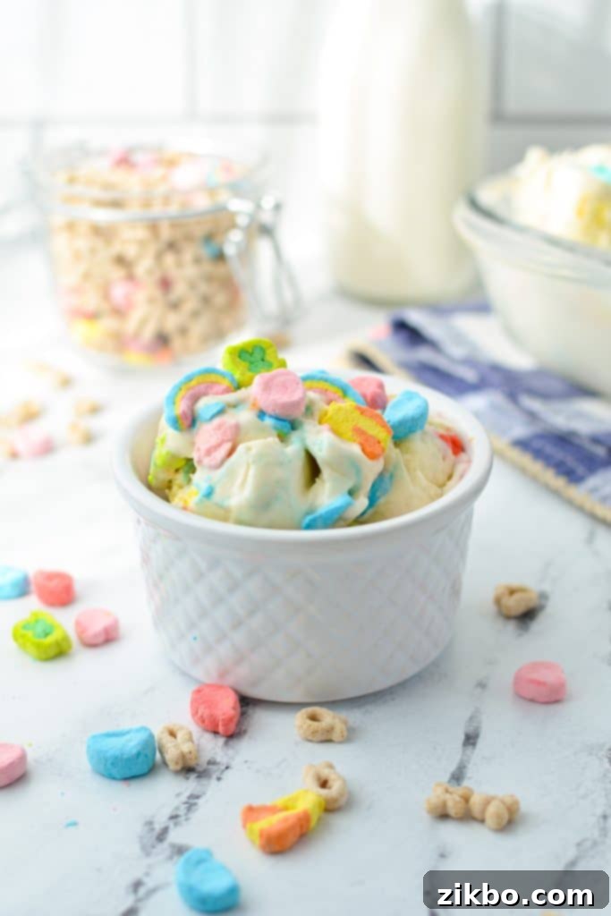 A small bowl with creamy ice cream and scattered Lucky Charms marshmallows, hinting at a delightful dessert.