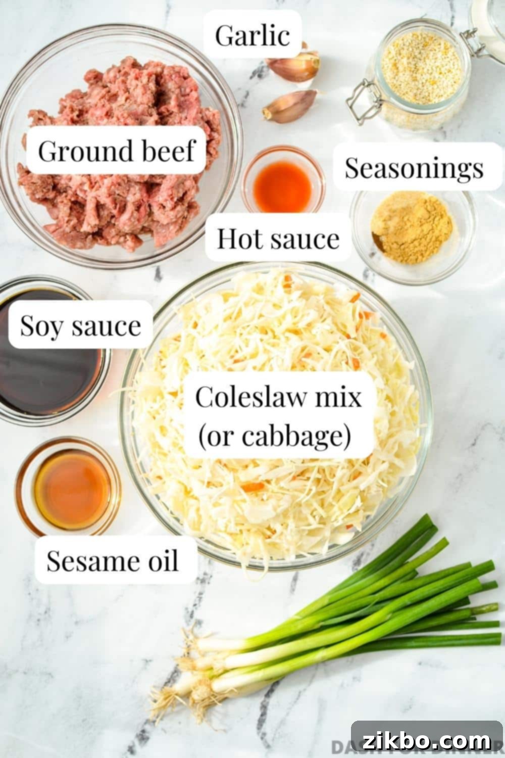 The ingredients laid out to make inside out egg roll: fresh cabbage, ground meat, soy sauce, sesame oil, and various seasonings.