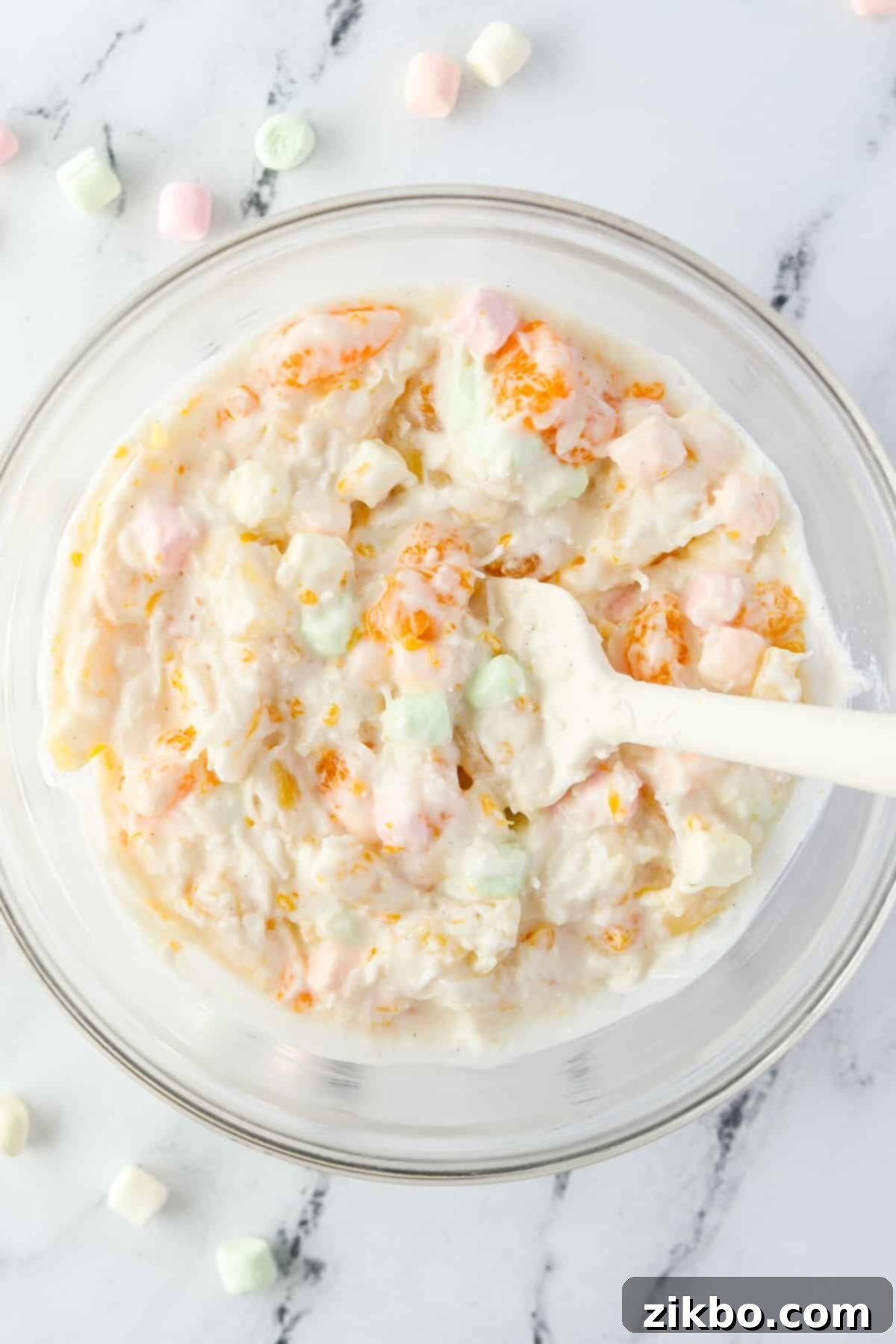 A bowl of marshmallow and fruit salad.