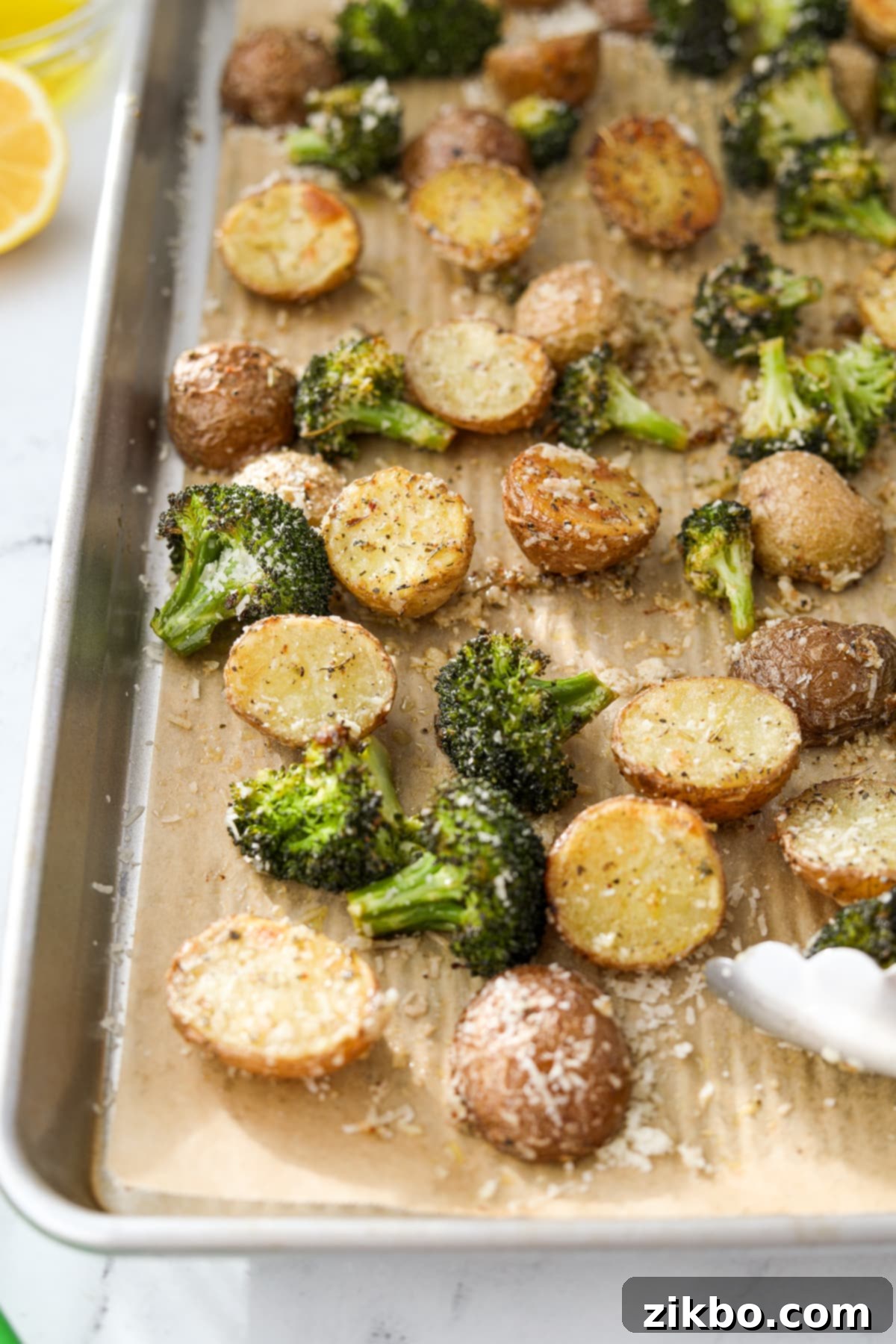Crispy Roasted Broccoli and Potatoes 8 A full sheet pan of perfectly roasted broccoli and potatoes, ready to be served as a delicious and healthy side dish.