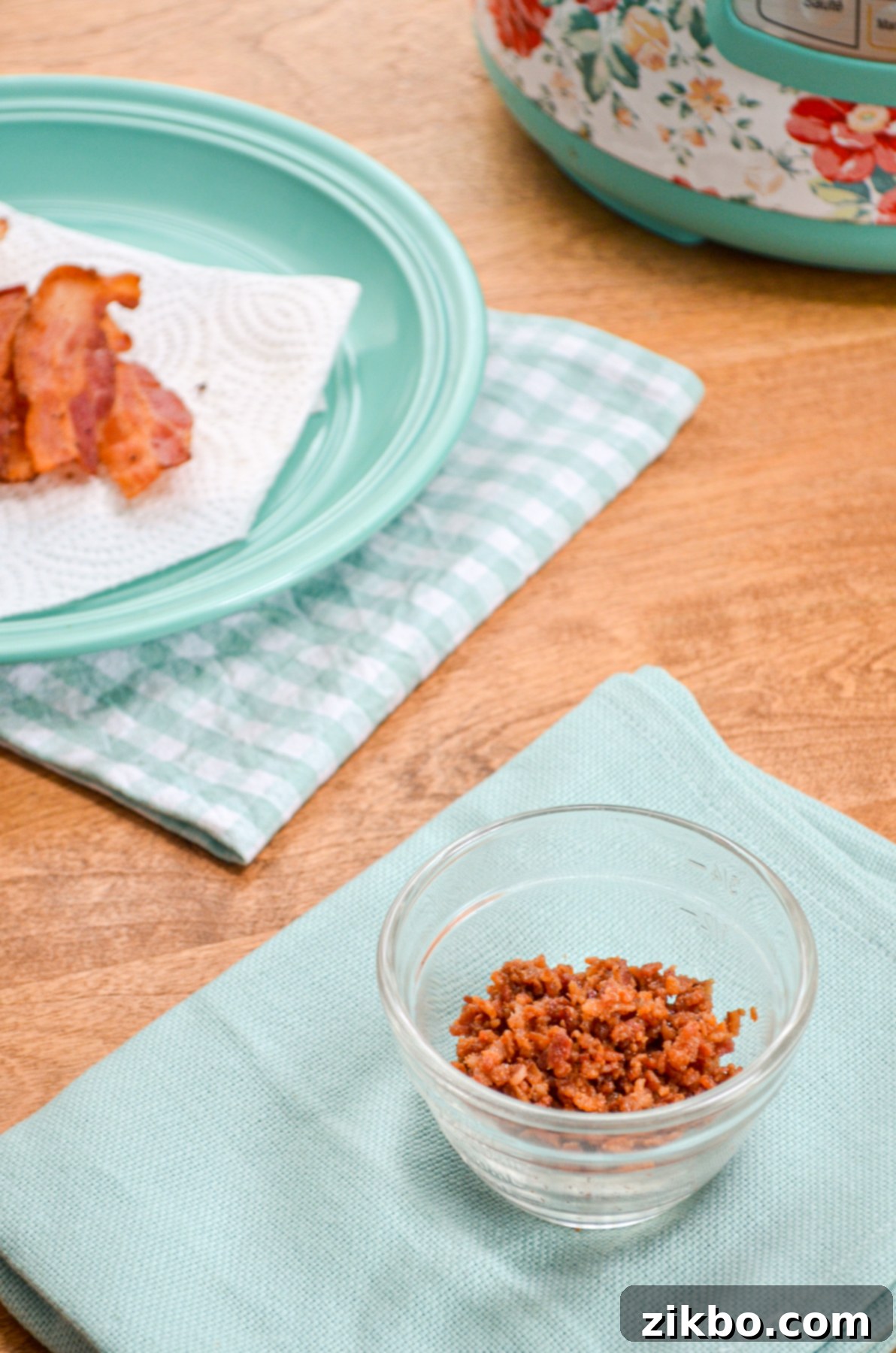 A small bowl filled with homemade Instant Pot bacon bits.