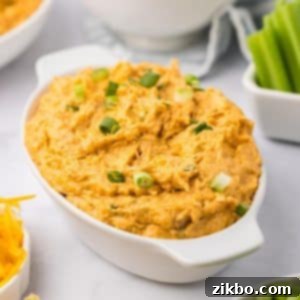 Buffalo chicken dip in an oval baking dish.