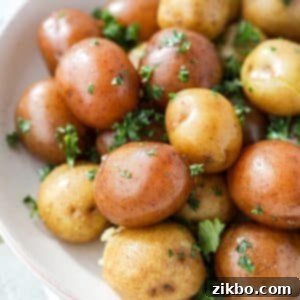 Baby potatoes, buttered and garnished with parsley.