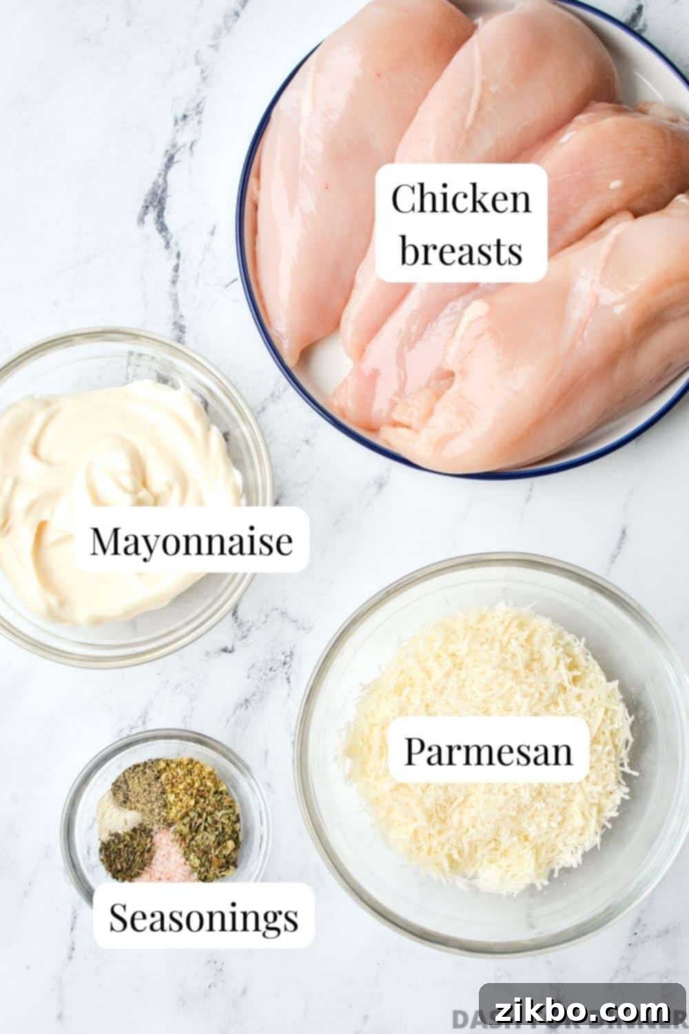 Creamy Parmesan Chicken 3 The simple, essential ingredients needed to make Mayo Parmesan Chicken: chicken breasts, mayonnaise, a blend of herbs and seasonings, and grated parmesan cheese.