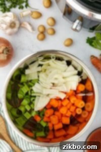 An Instant Pot filled with vegetables.