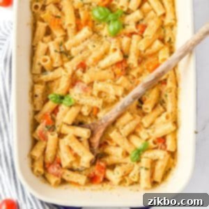 A baking dish with creamy pasta garnished with fresh basil, showcasing the delightful Boursin pasta.