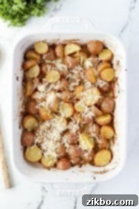 Roasted potatoes with shredded parmesan cheese on top.