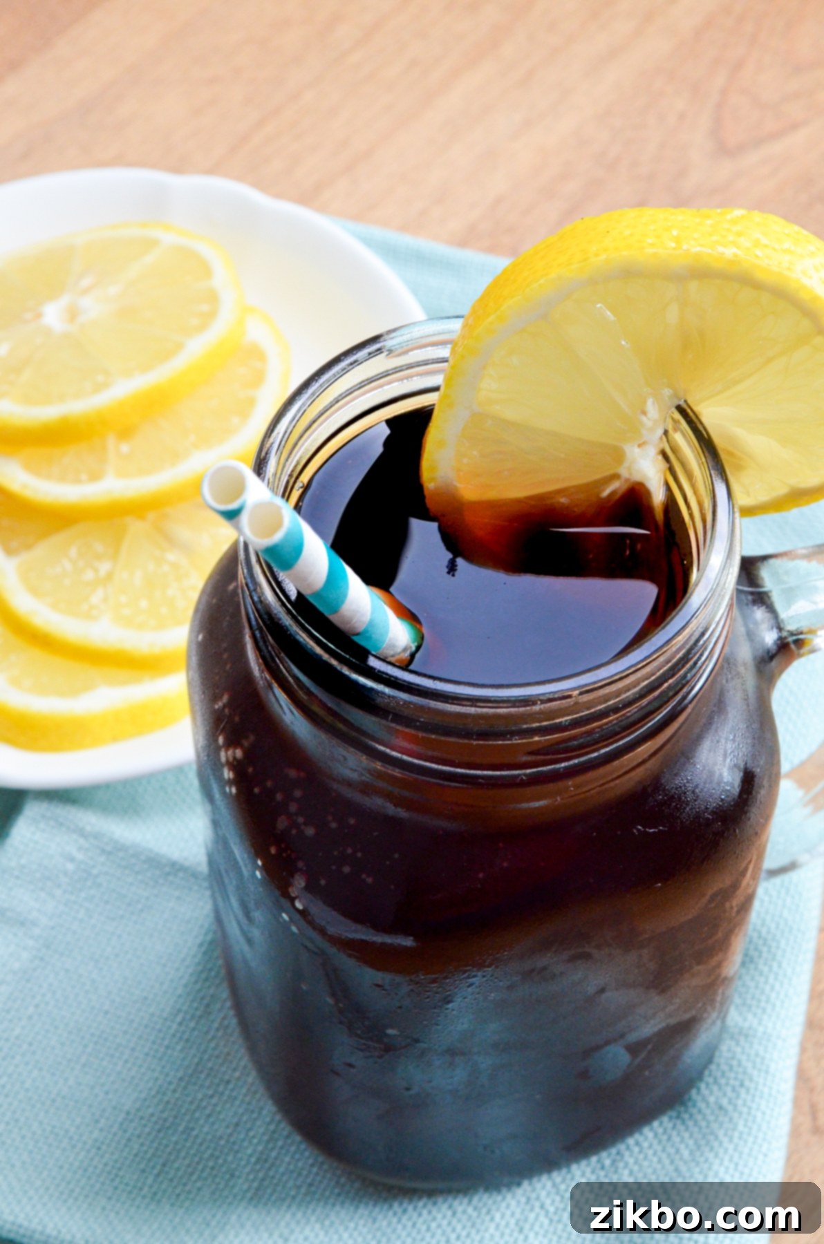 Instant Pot Iced Tea Crystal Clear and Smooth 4 A beautifully chilled glass of iced sweet tea, garnished with a vibrant lemon slice, ready to be enjoyed.