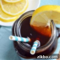 Instant Pot Iced Tea Crystal Clear and Smooth 9 A glass of iced tea, garnished with a lemon slice.