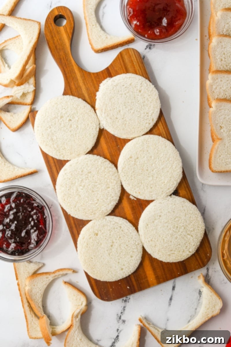 A cutting board with 6 bread rounds.
