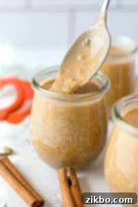 Spoon an overnight oatmeal mixture into a jar.