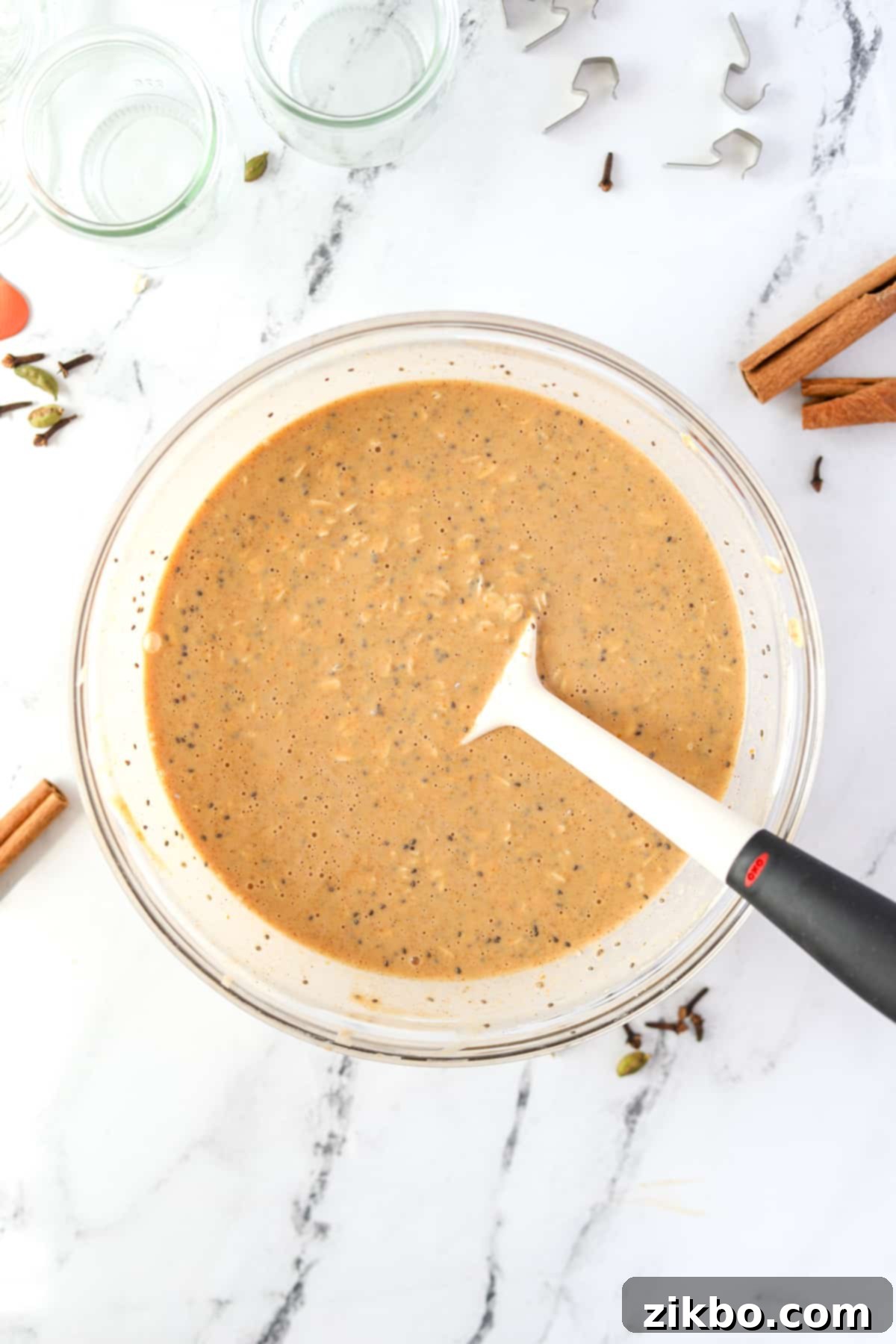 A bowl of overnight oats mixed together and ready to be transferred into jars.