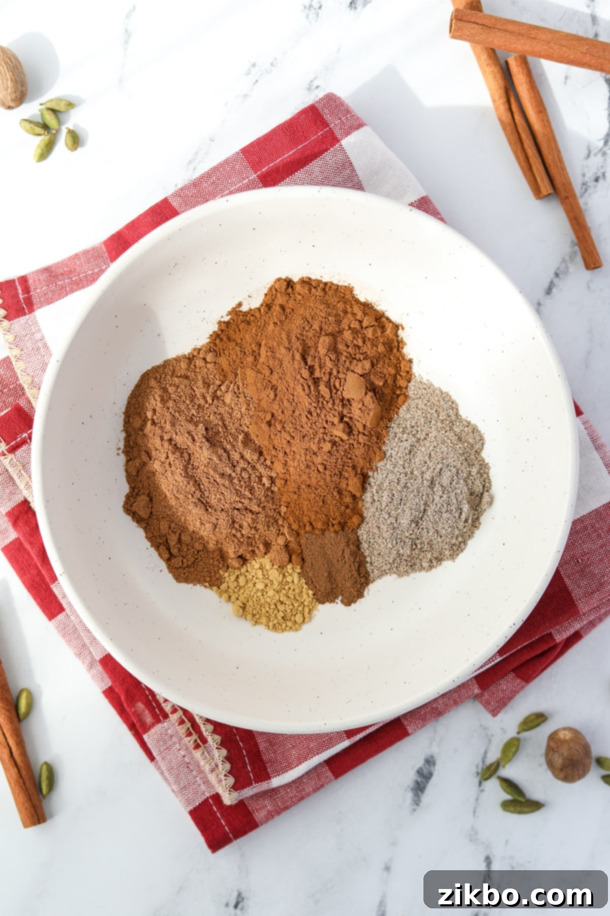 A small bowl with various spices inside, neatly measured out and ready to be combined.